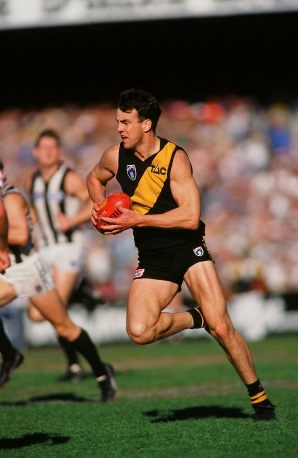 AFL 1995 Round 21 - Richmond v Collingwood Scott Turner of the Tigers runs the ball forward during the 1995 round 21 AFL match between the Richmond Tigers and the Collingwood Magpies at the Melbourne Cricket Ground.